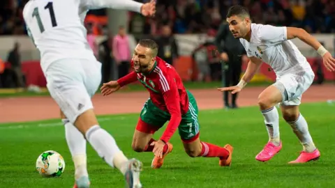 AFP Morocco's Zakaria Hadraf (C) is tacked by Libya's Meftah Taqtaq (R) during the semi-final football match in the African Nations Championship between Morocco and Libya at the Mohammed V Casablanca Stadium on January 31, 2018