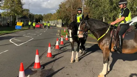 Police riders outside Bletchley Park