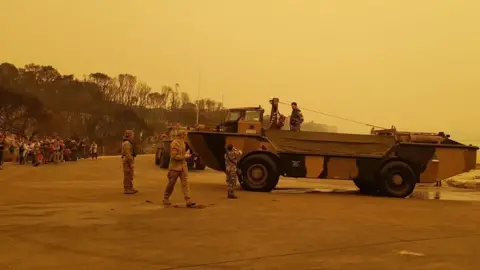 FRAN LAWSON Army vehicle in Mallacoota helps evacuate people