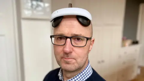 Nikki Fox/BBC Ashley Riley wearing the electric flow device