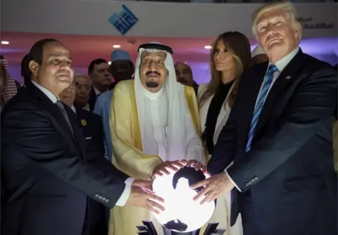 EPA Abdul Fattah al-Sisi (left), Salman bin Adbulaziz (centre) and Donald Trump put their hands on an illuminated globe, Riyadh (21/05/17)