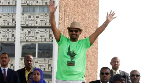 Reuters Mr Abiy waves during his speech