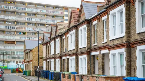 Getty Images Houses with council block in background in south east London