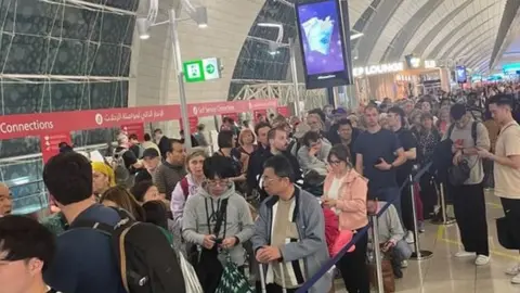 Anne Wing Queues at Dubai International Airport