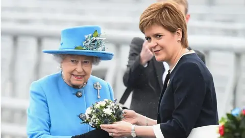 Getty Images Queen Elizabeth II poses with Scottish First Minister Nicola Sturgeon on the Queensferry Crossing during the official opening ceremony, on September 4, 2017 in South Queensferry, Scotland