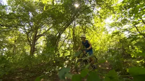 Cyclist in action on trail