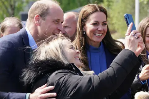 PA Media The Duke and Duchess of Cambridge meet crowds during a visit to the Wheatley Group in Glasgow