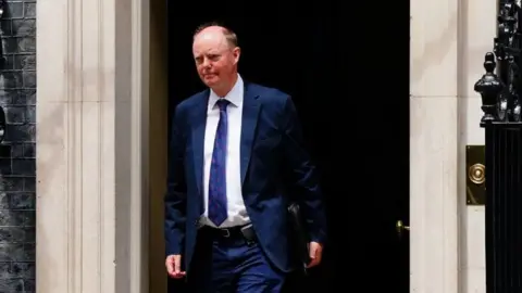 PA Media Professor Sir Chris Whitty leaving number 10 Downing Street