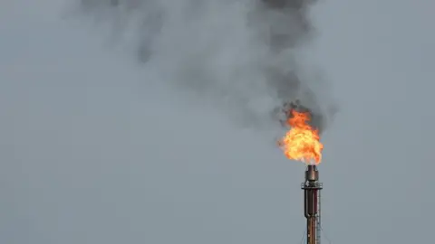 Flaring gas at a processing plant in the UK