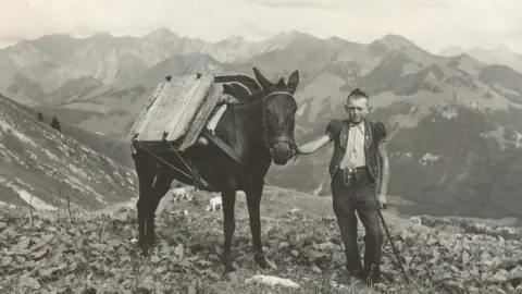 Swiss Farmers Union Archive photo of a boy and his horse on the Alps