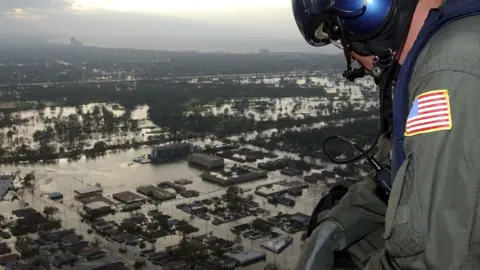 Getty Images US personnel looks out over new orleans buried in water