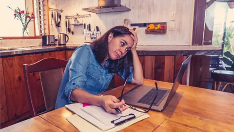 Getty Images Woman looking at her computer