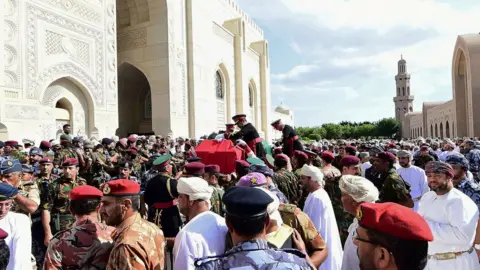 Reuters Mourners carry the coffin of late Sultan Qaboos during the funeral in Muscat