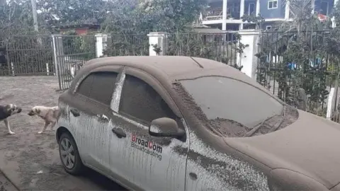 Consulate of the Kingdom of Tonga A car covered in ash