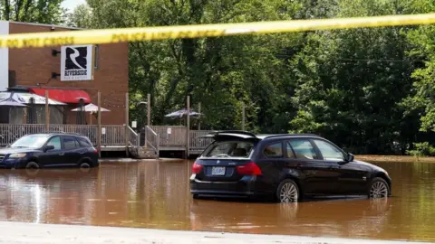 Reuters Vehicles partially submerged are seen after the heaviest rain to hit the Atlantic Canadian province of Nova Scotia in more than 50 years triggered floods, in Bedford, Halifax, Nova Scotia, Canada July 23, 2023. REUTERS/John Morris