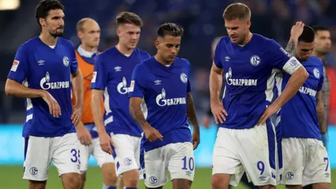 Getty Images Schalke players with the Gazprom logo on their shirts in September 2021