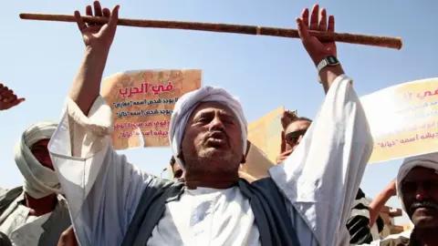 Getty Images Supporters of the Sudanese army rally outside the office of the United Nations mission, west of Sudan's capital Khartoum, on February 5, 2022