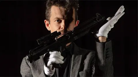 Royal Armouries Jonathan Ferguson, Keeper of Firearms and Artillery with the ‘Imperial Stormtrooper E-11 blaster’
