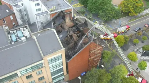 Northern Ireland Fire & Rescue Service An aerial view of the damage to the top of the roof