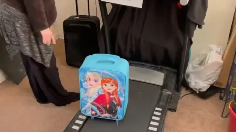 Dom Hodgson Treadmill doubling as a luggage collection point