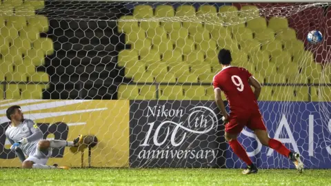 Robert Cianflone/Getty Images Omar Al Somah equalises from the penalty spot for Syria against Australia