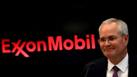 Reuters Exxon chief executive Darren Woods