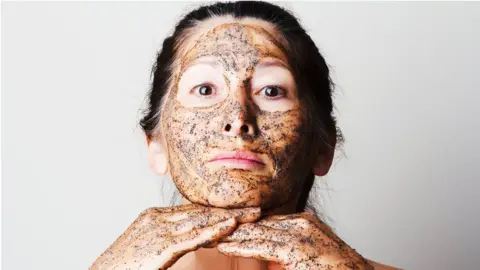Getty Images woman with face scrub on