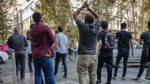 EPA Protesters clash with riot police in Tehran, Iran (8 October 2022)