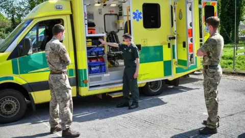 PA Media Military personnel and ambulance service