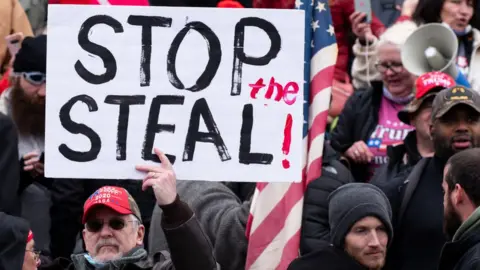 Man protesting against Trump's election loss