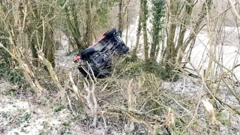 Twitter / @SWP_Roads A 4x4 overturned in Bridgend