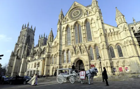 PA The funeral cortege for seven-year-old Katie Rough leaves York Minster following a funeral service