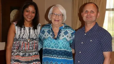 Andrew Leslie Andrew (right) with his wife, Anu, (left) and mother, Helen, (centre)