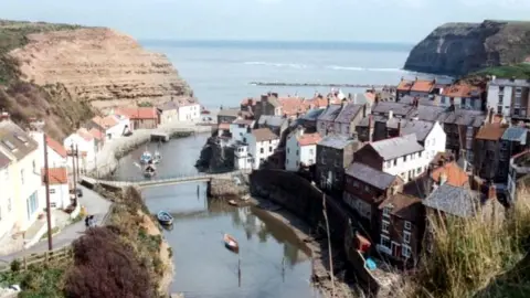 Paul Allison/Geograph North East Ambulance Service was called at 16:18 BST to the beach at Staithes, North Yorkshire