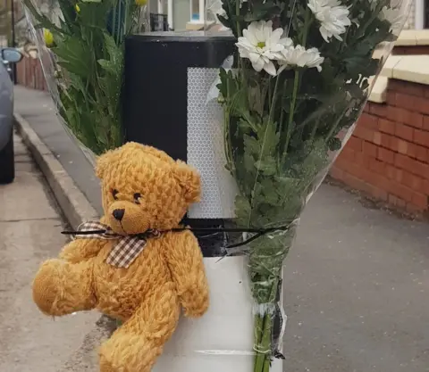 PA Floral tribute and teddy bear