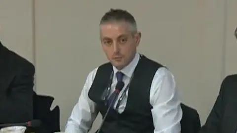 Man attending meeting