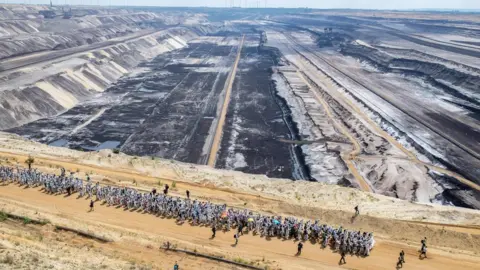 AFP Activists walking through the Garzweiler mine