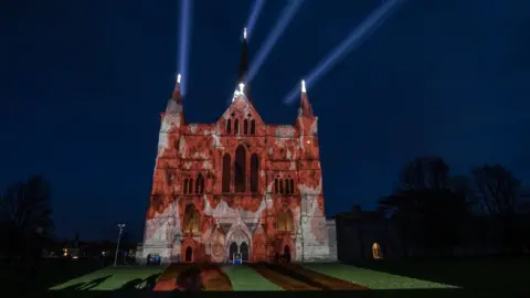 Getty Images The Royal British Legion"s falling poppy display is projected onto the West Front of Salisbury Cathedral to commemorate the 100th anniversary of the armistice in Salisbury