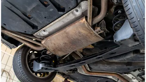 A motor part from underneath a car