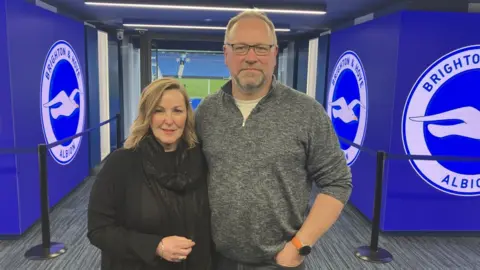 Malcolm Bashford and Candice Konig in the Amex Stadium tunnel