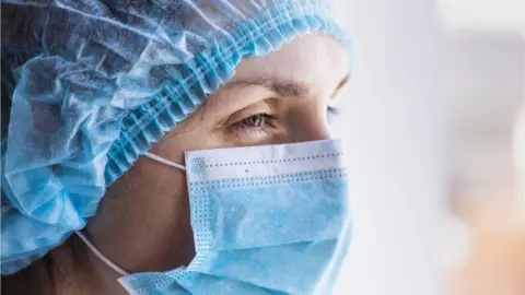 Getty Images Health worker in PPE