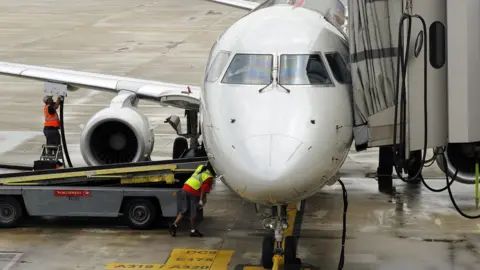 Getty Images An aeroplane being refuelled at a US airport