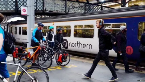 PA Media Passengers at Newcastle station in 2018