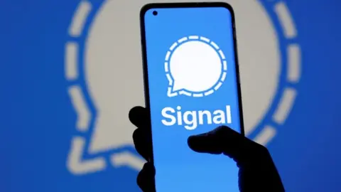 Reuters The Signal messaging app logo is seen on a smartphone