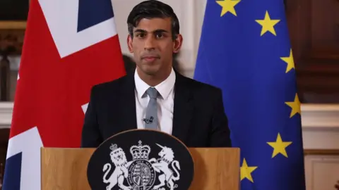 Getty/DAN KITWOOD Prime Minister Rishi Sunak holds a press conference with the European Commission chief (not seen) following their meeting at the Fairmont Hotel in Windsor, west of London, on February 27, 2023