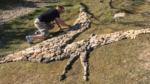 Booker family James making a dinosaur