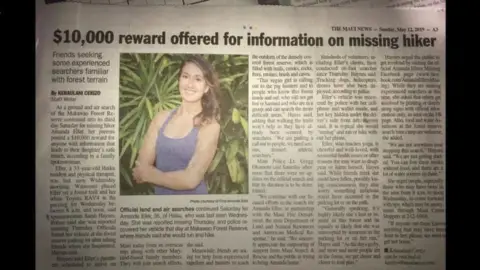 @Findamanda Facebook Photograph of a newspaper article showing a photograph of Amanda