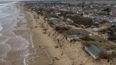 BlueSky UAV Drone shot of cliff-top chalets