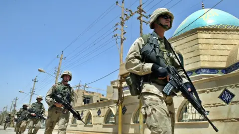 EPA-EFE/REX/Shutterstock Soldiers carrying M-16s