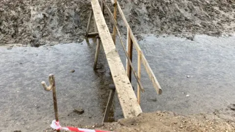 Jill Bennett/BBC The makeshift bridge at Stiffkey